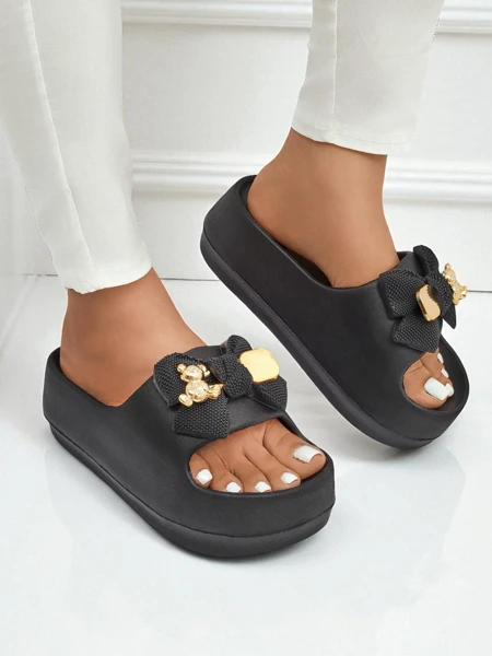 Royalfashion Women's rubber flip-flops with a decorative bow Alday