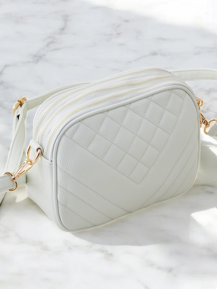 Royalfashion Small women's handbag made of eco-leather with embossing