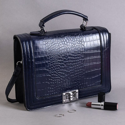 An elegant navy blue embossed handbag - Handbags