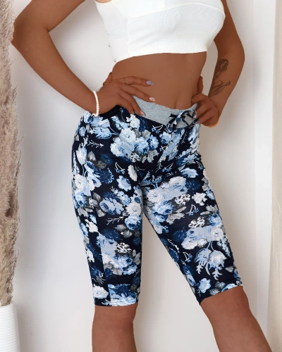 Blue women's 3/4 length shorts with floral pattern - Clothing