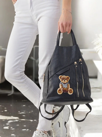 Royalfashion Small women's eco-leather triangular backpack with a teddy bear