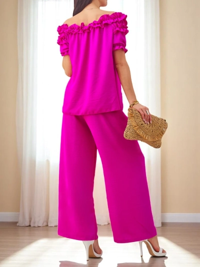 Royalfashion Sieviešu komplekts ar plecus atklājošu blūzi ar īsām piedurknēm un dekoratīvu kakla izgriezumu, kā arī platām biksēm