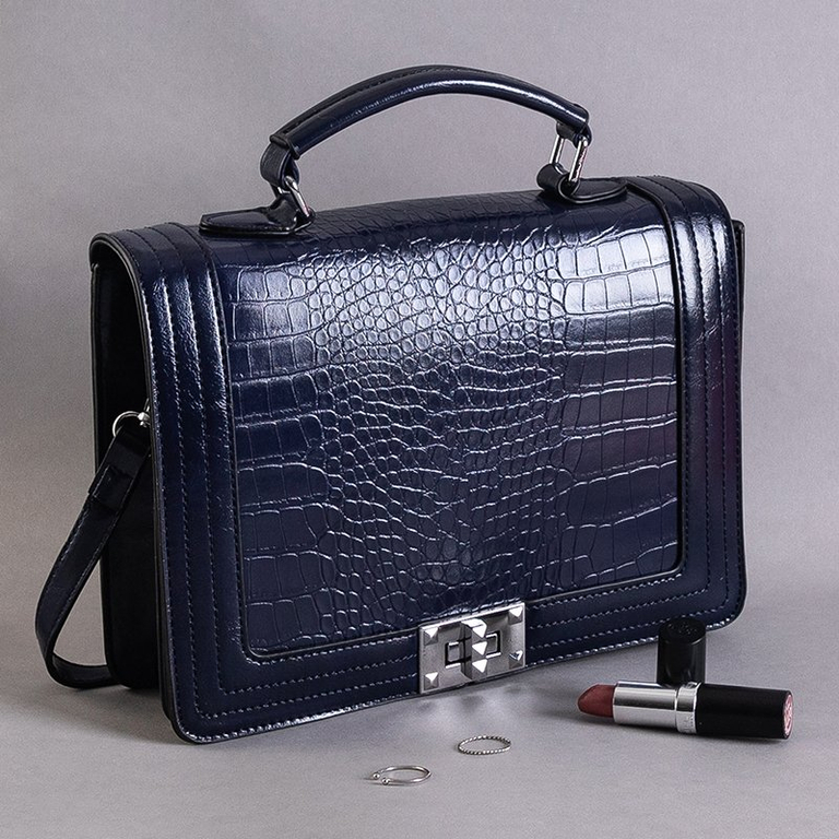 An elegant navy blue embossed handbag - Handbags